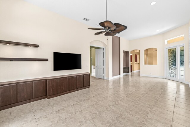 6346 San Michel Way, Delray Beach, FL 33484 - unfurnished living room with arched walkways, baseboards, visible vents, recessed lighting, and ceiling fan