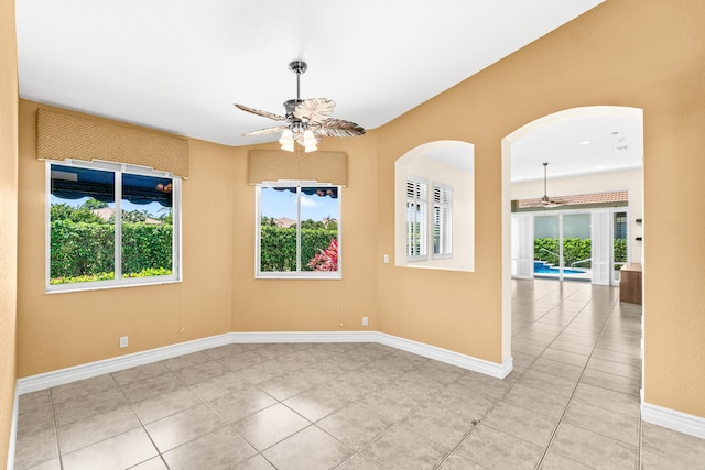 6346 San Michel Way, Delray Beach, FL 33484 - empty room with light tile patterned floors, a ceiling fan, and plenty of natural light