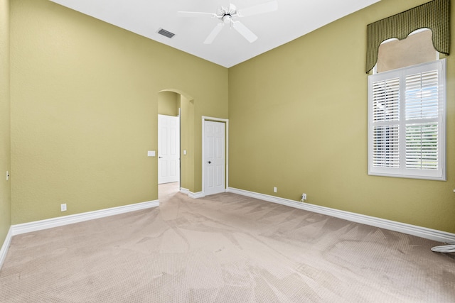 6346 San Michel Way, Delray Beach, FL 33484 - carpeted spare room with visible vents, a ceiling fan, arched walkways, baseboards, and high vaulted ceiling