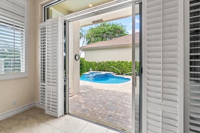 6346 San Michel Way, Delray Beach, FL 33484 - doorway with baseboards and light tile patterned floors