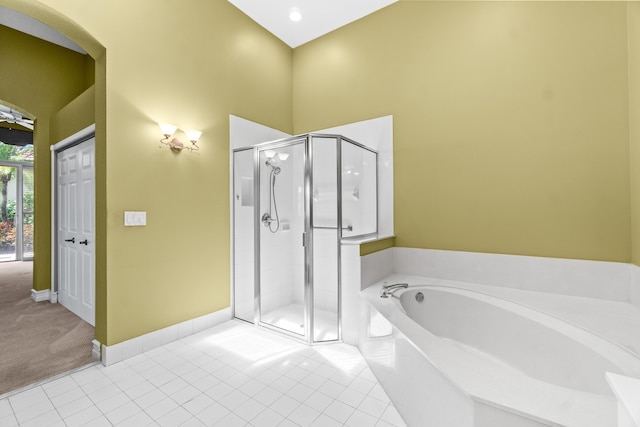 6346 San Michel Way, Delray Beach, FL 33484 - bathroom featuring a shower stall, a garden tub, and tile patterned floors