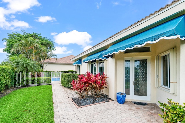 6346 San Michel Way, Delray Beach, FL 33484 - view of yard featuring fence and french doors