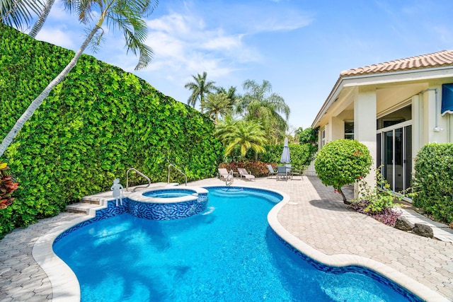 6346 San Michel Way, Delray Beach, FL 33484 - view of swimming pool with a patio and a pool with connected hot tub