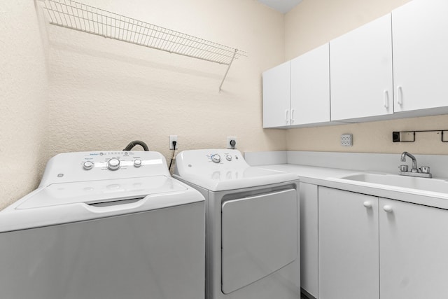 6346 San Michel Way, Delray Beach, FL 33484 - washroom featuring cabinet space, washing machine and dryer, and a sink