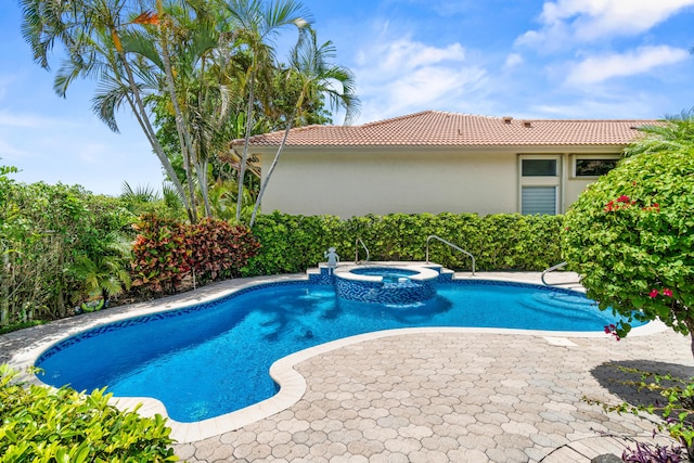 6346 San Michel Way, Delray Beach, FL 33484 - view of swimming pool featuring a pool with connected hot tub and a patio