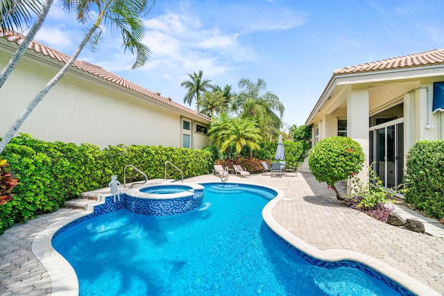 6346 San Michel Way, Delray Beach, FL 33484 - view of pool with a pool with connected hot tub and a patio
