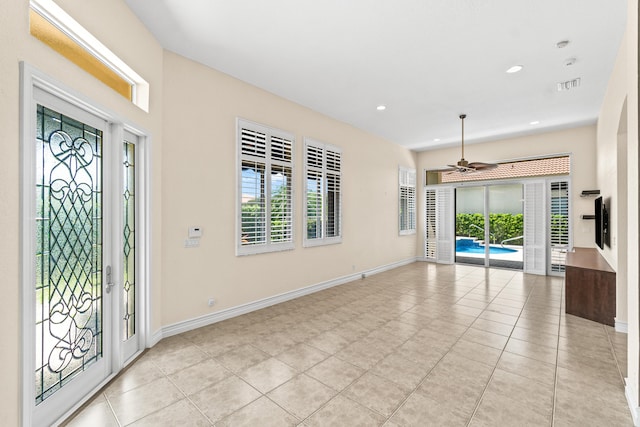 6346 San Michel Way, Delray Beach, FL 33484 - entrance foyer with a ceiling fan, baseboards, light tile patterned flooring, and visible vents