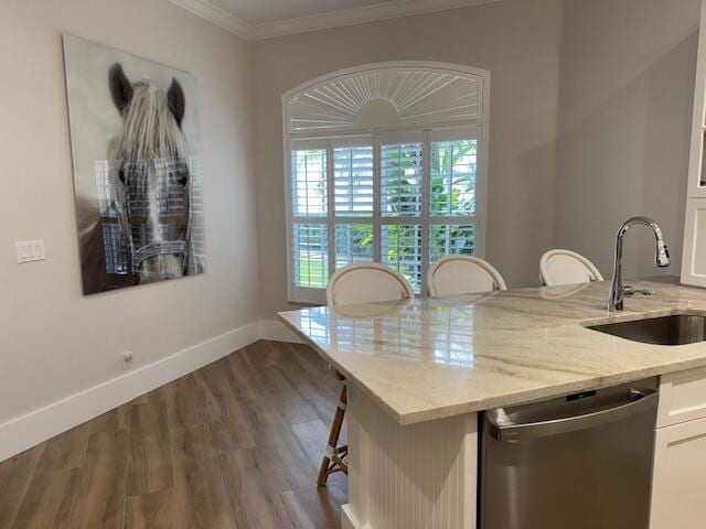 12624 Mallet Cir, Wellington, FL 33414 - kitchen featuring dishwasher, a sink, crown molding, light stone counters, and wood finished floors