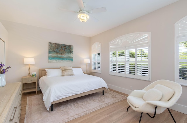 12624 Mallet Cir, Wellington, FL 33414 - bedroom with light wood finished floors, baseboards, and a ceiling fan