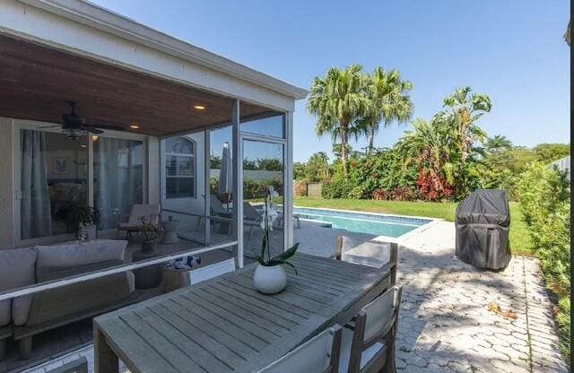 12624 Mallet Cir, Wellington, FL 33414 - view of patio with an outdoor pool and a sunroom
