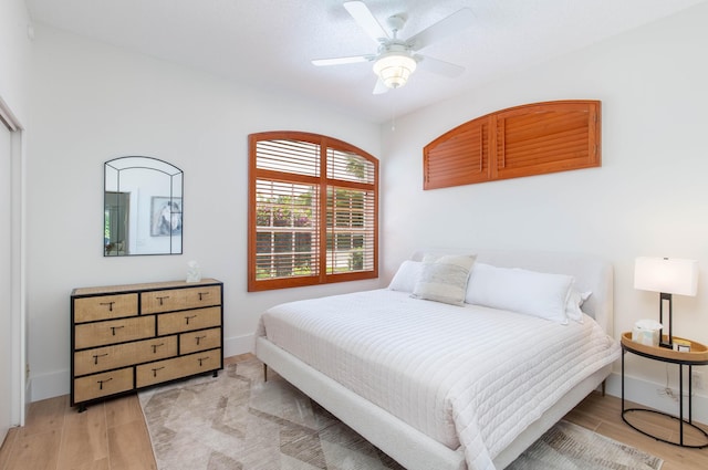 12624 Mallet Cir, Wellington, FL 33414 - bedroom with light wood-type flooring, baseboards, and a ceiling fan