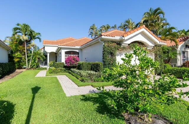 12624 Mallet Cir, Wellington, FL 33414 - mediterranean / spanish home featuring stucco siding, a tile roof, and a front yard