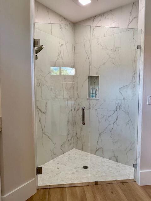 12624 Mallet Cir, Wellington, FL 33414 - full bathroom featuring a marble finish shower and wood finished floors