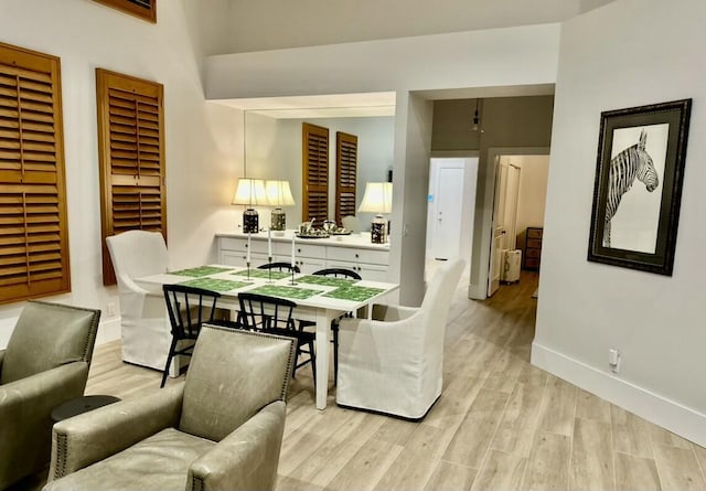 12624 Mallet Cir, Wellington, FL 33414 - dining space featuring baseboards and light wood-type flooring