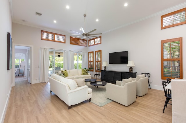 12624 Mallet Cir, Wellington, FL 33414 - living room featuring ceiling fan, baseboards, recessed lighting, a high ceiling, and ornamental molding