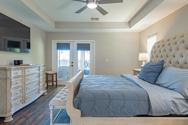 bedroom featuring visible vents, multiple windows, a tray ceiling, french doors, and access to outside