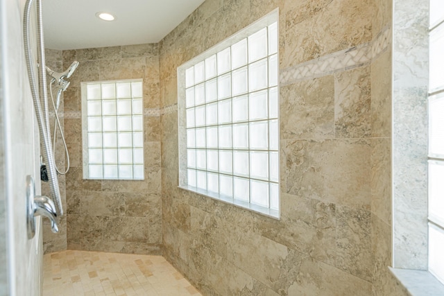bathroom with tiled shower