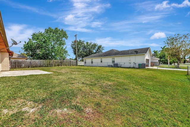 view of yard featuring fence and a patio area