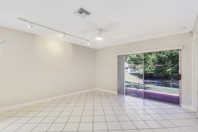 spare room featuring visible vents, baseboards, ceiling fan, and track lighting