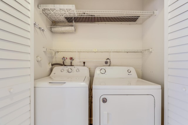 washroom with laundry area and washer and clothes dryer