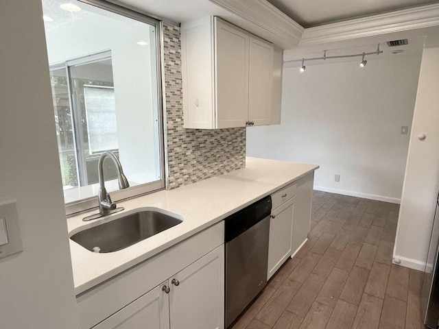 6401 NE 7th Ave, Boca Raton, FL 33487 - kitchen with dishwasher, a sink, light countertops, dark wood-type flooring, and crown molding