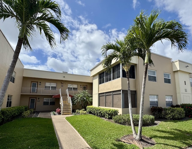 view of property featuring stairs