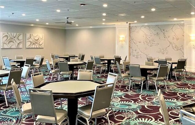 dining space with crown molding, carpet floors, recessed lighting, and a drop ceiling
