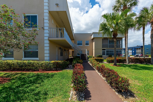 view of property featuring stairs