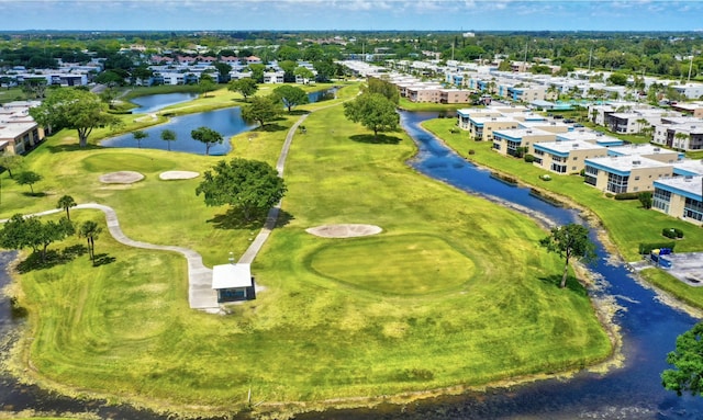 bird's eye view with a water view and golf course view