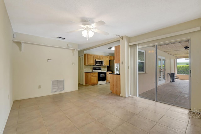 7140 Bobalink Ct, Lake Worth, FL 33467 - unfurnished bedroom with a walk in closet, baseboards, visible vents, and carpet