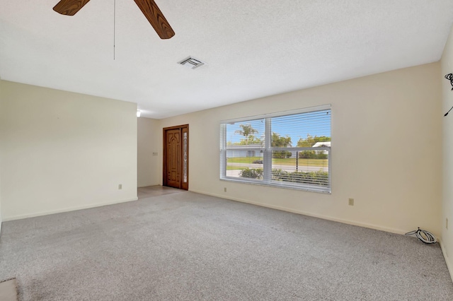 7140 Bobalink Ct, Lake Worth, FL 33467 - unfurnished room with ceiling fan with notable chandelier, light tile patterned floors, light carpet, french doors, and visible vents