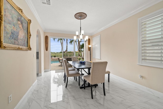 dining room featuring a chandelier, marble finish floor, arched walkways, baseboards, and visible vents
