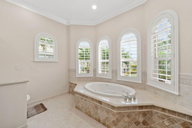 full bathroom featuring crown molding, a tub with jets, toilet, and tile patterned floors