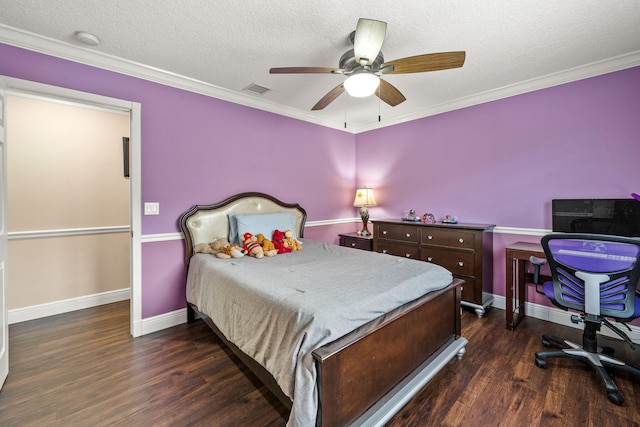 bedroom featuring baseboards, wood finished floors, visible vents, and a textured ceiling