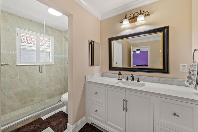 full bath featuring crown molding, toilet, vanity, and a stall shower