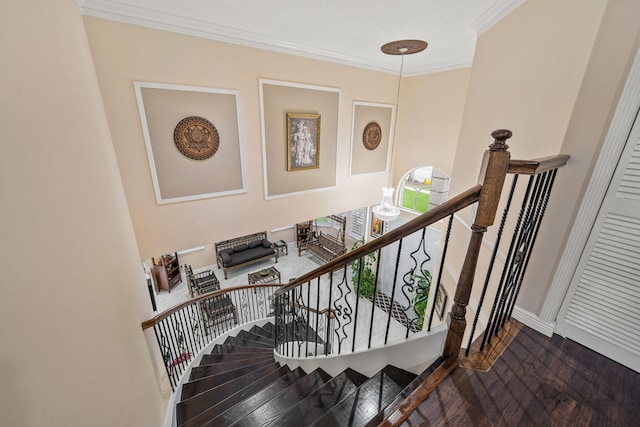 staircase featuring baseboards and ornamental molding
