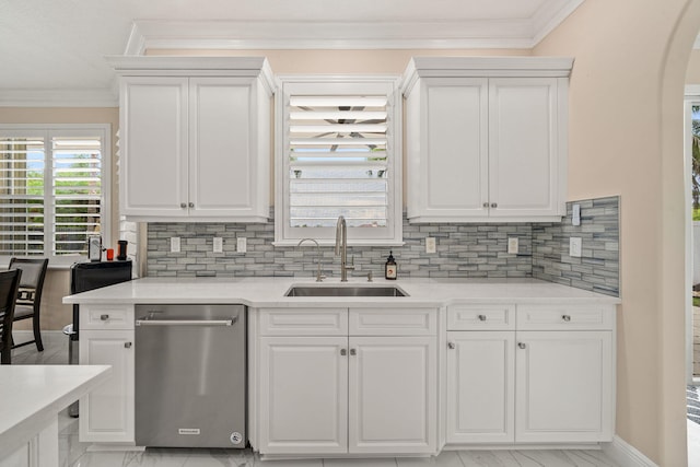 kitchen featuring white cabinets, dishwasher, a sink, crown molding, and decorative backsplash