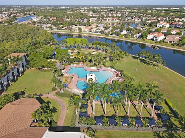 birds eye view of property featuring a water view and a residential view