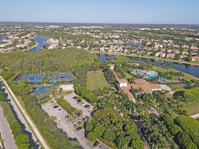drone / aerial view with a water view and a residential view