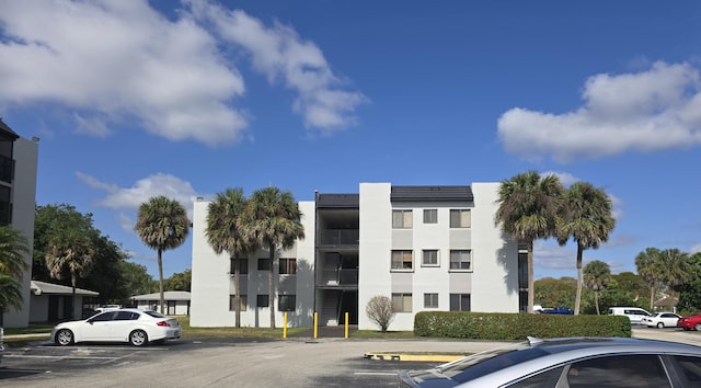 view of property with uncovered parking