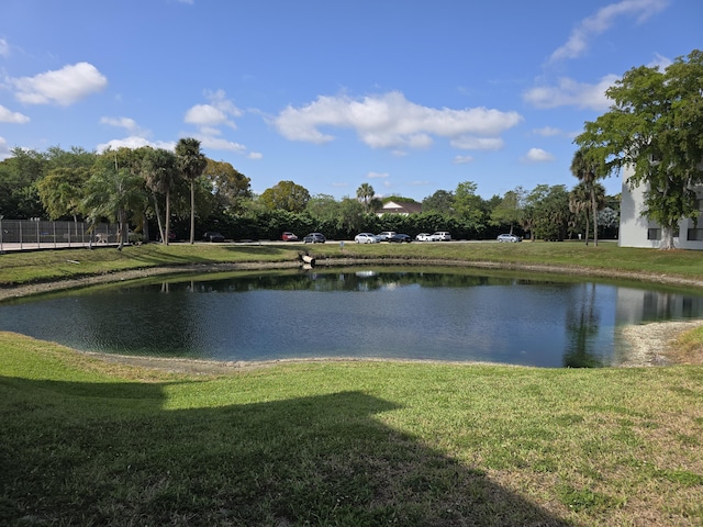 property view of water featuring fence