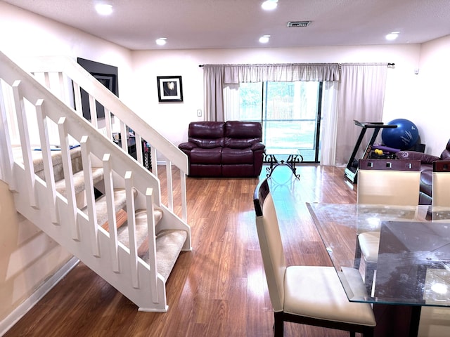 3779 Carambola Cir N Unit 28102, Coconut Creek, FL 33066 - living room with wood finished floors, stairway, baseboards, and recessed lighting