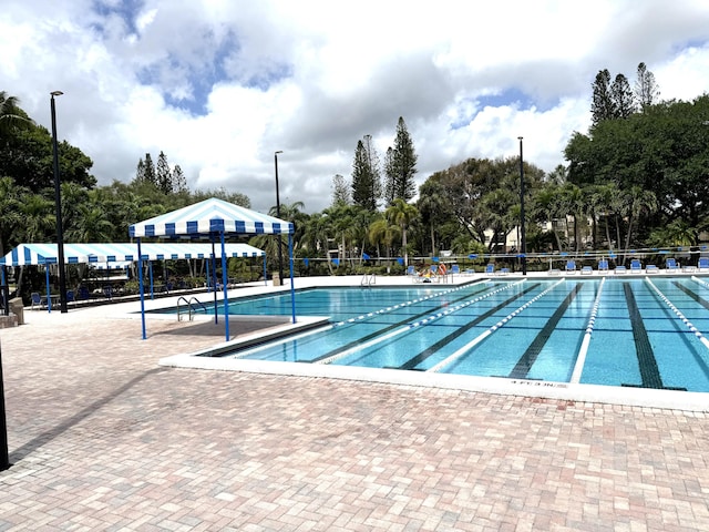 3779 Carambola Cir N Unit 28102, Coconut Creek, FL 33066 - community pool with view of wooded area