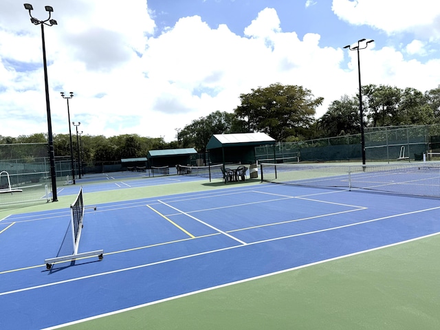 3779 Carambola Cir N Unit 28102, Coconut Creek, FL 33066 - view of tennis court featuring community basketball court