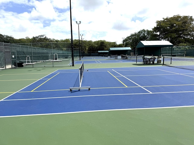 3779 Carambola Cir N Unit 28102, Coconut Creek, FL 33066 - view of tennis court featuring community basketball court