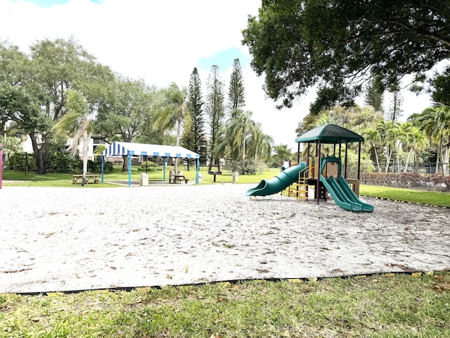 3779 Carambola Cir N Unit 28102, Coconut Creek, FL 33066 - community play area featuring view of wooded area