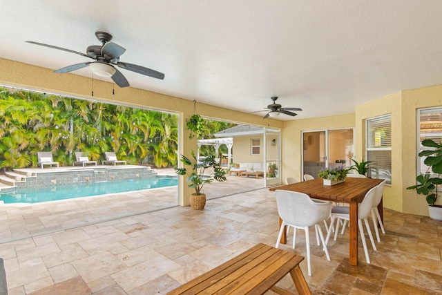 outdoor pool with a ceiling fan, outdoor dining area, and a patio