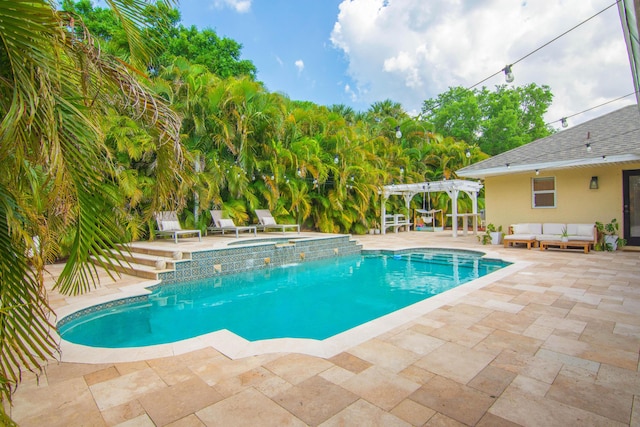 swimming pool with outdoor lounge area, a pergola, a patio, and an in-ground hot tub