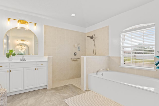 full bath with a walk in shower, a bath, and vanity