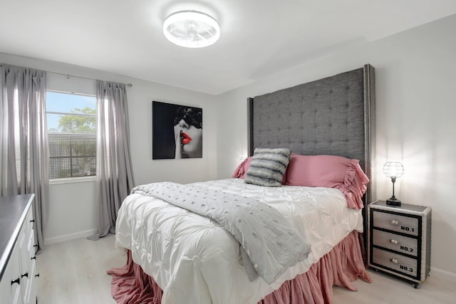 373 Piedmont H, Delray Beach, FL 33484 - bedroom featuring baseboards and light wood-type flooring